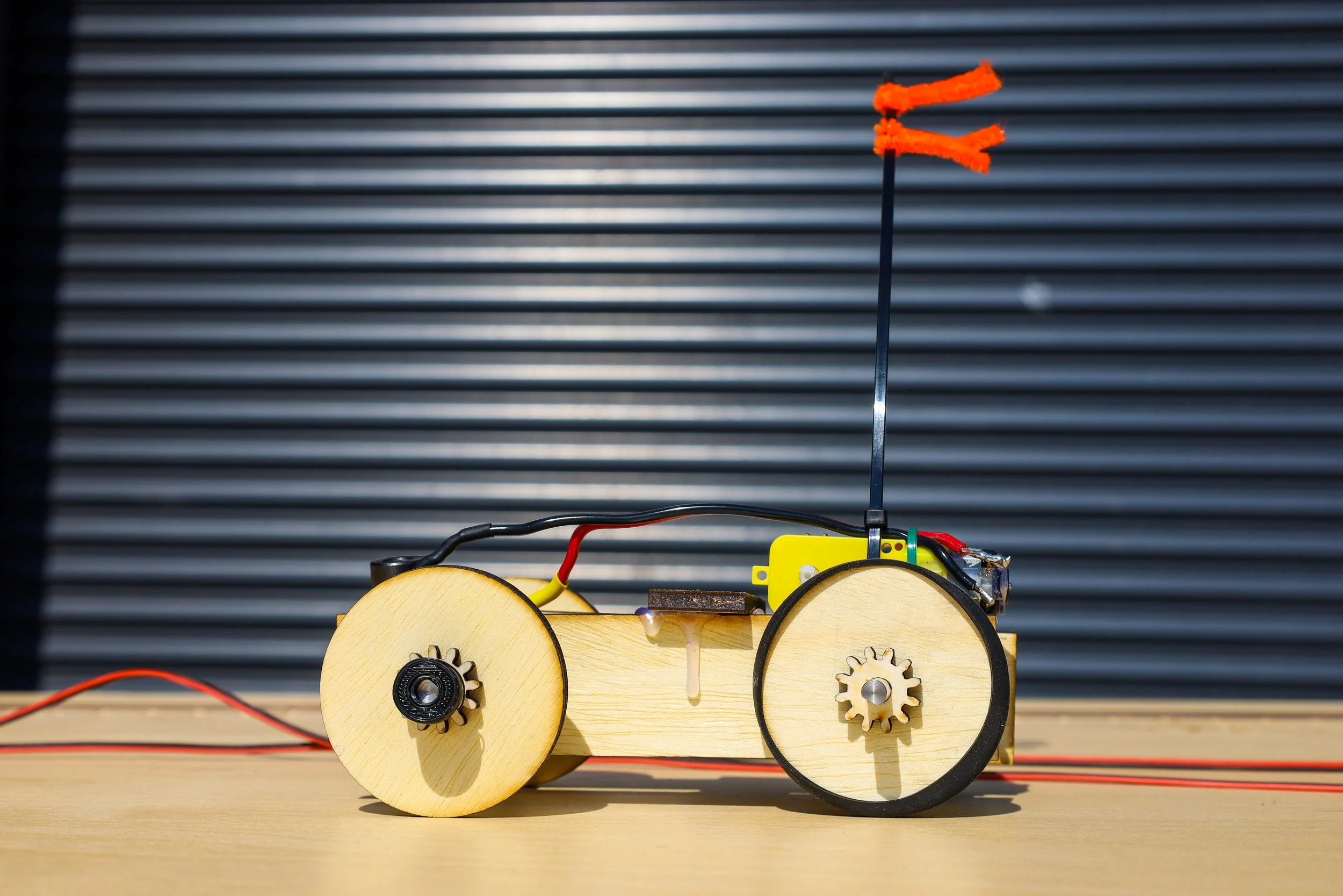 Student soldering electronics on a workbench